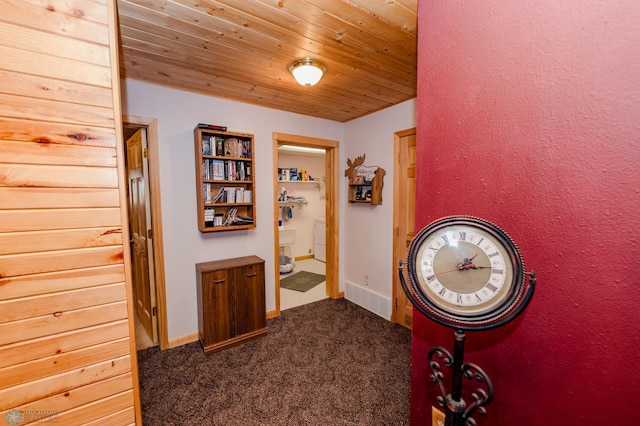 corridor with carpet flooring and wooden ceiling