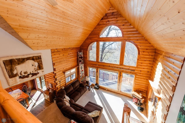 living room with high vaulted ceiling, hardwood / wood-style flooring, wooden ceiling, and log walls