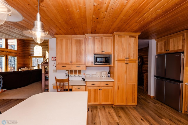 kitchen with stainless steel appliances, wood ceiling, light hardwood / wood-style flooring, light brown cabinetry, and decorative light fixtures