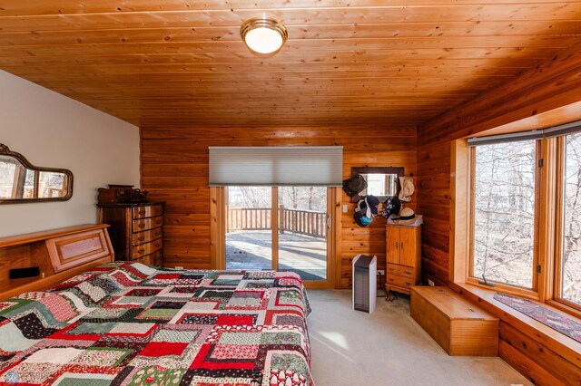 bedroom featuring wooden ceiling and multiple windows