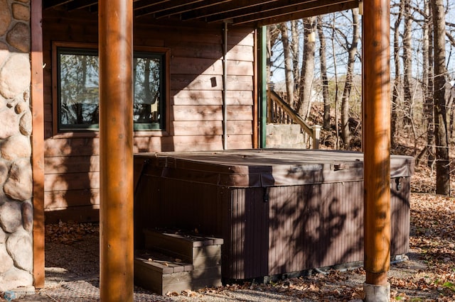 exterior space featuring a hot tub