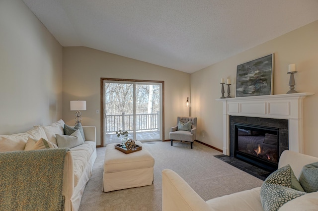 carpeted living room with lofted ceiling and a textured ceiling