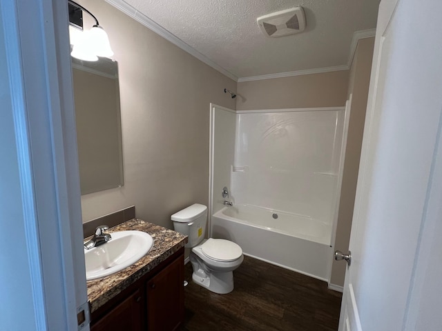 full bathroom with ornamental molding, vanity, shower / bathing tub combination, hardwood / wood-style flooring, and toilet