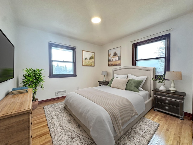 bedroom featuring light hardwood / wood-style floors