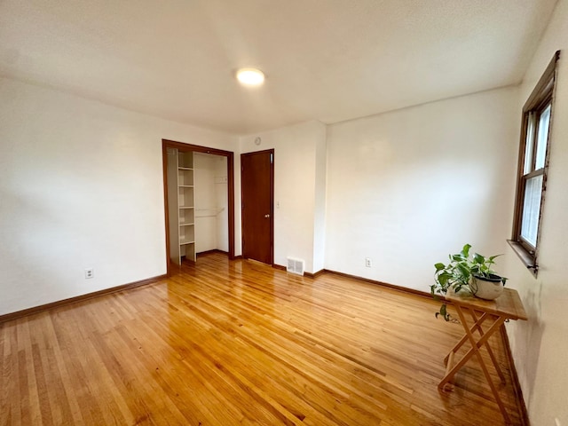 spare room featuring hardwood / wood-style floors