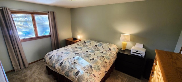 bedroom featuring dark colored carpet