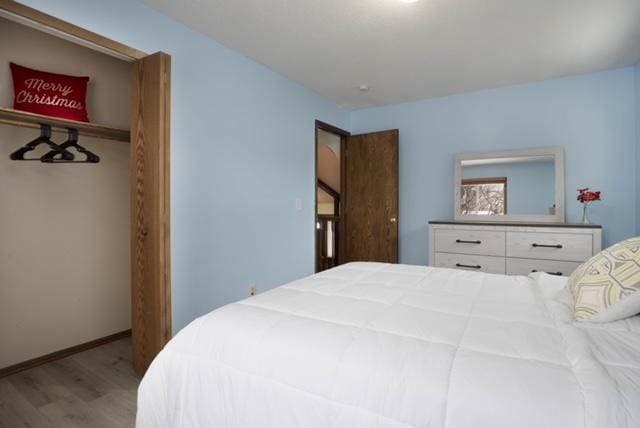 bedroom featuring hardwood / wood-style flooring