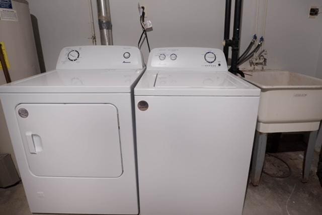 laundry room featuring separate washer and dryer and sink