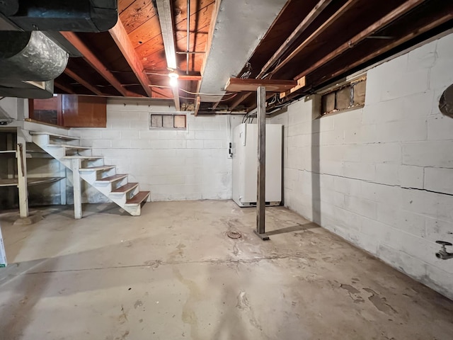 basement with white refrigerator