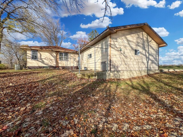 rear view of house with cooling unit