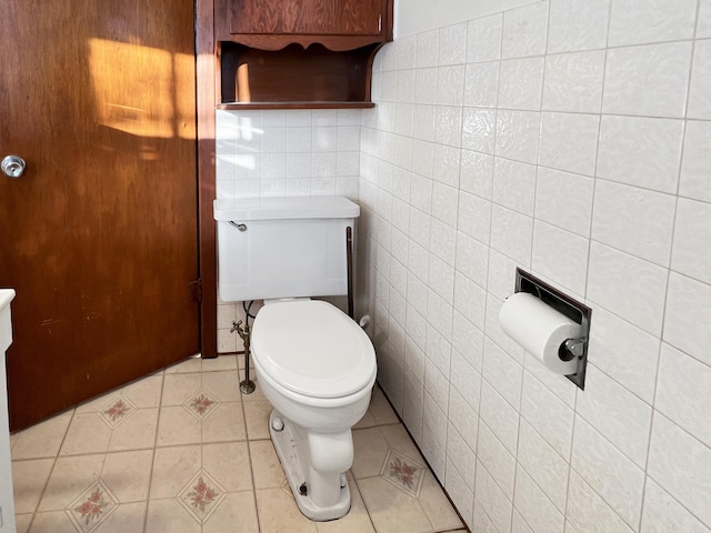 bathroom with tile patterned flooring, toilet, tile walls, and tasteful backsplash