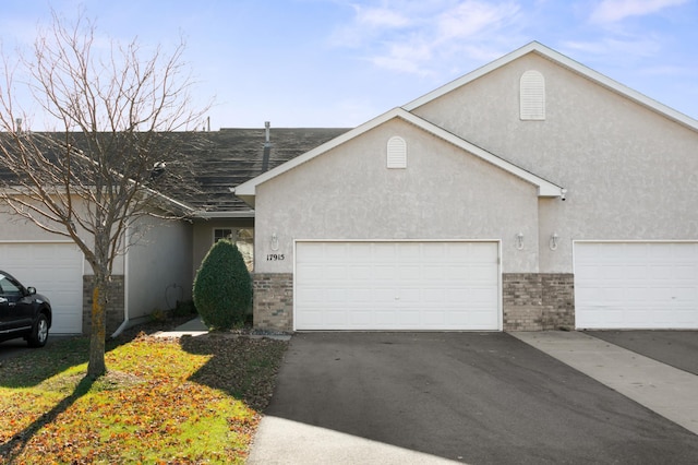 ranch-style house featuring a garage