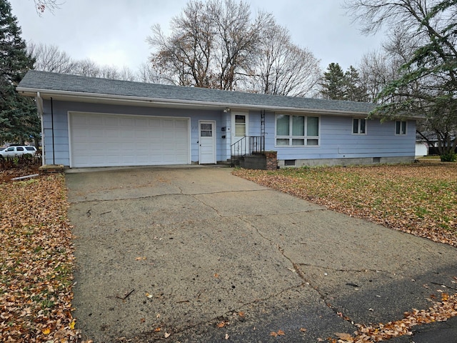 ranch-style house featuring a garage