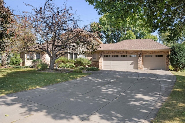 view of front of house with a garage and a front yard