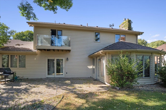 back of property with a patio area