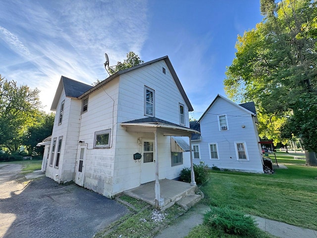 717 Jefferson Ave, Albert Lea, MN 56007 - back of house featuring a yard and a patio area