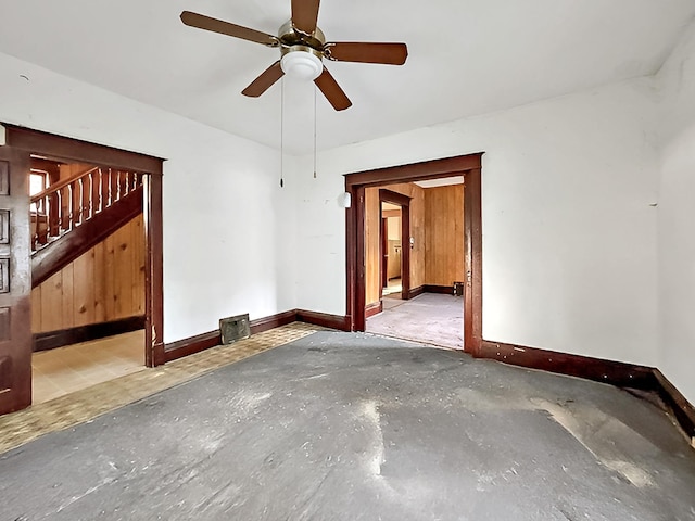 717 Jefferson Ave, Albert Lea, MN 56007 - unfurnished room with baseboards, concrete floors, a ceiling fan, and stairway