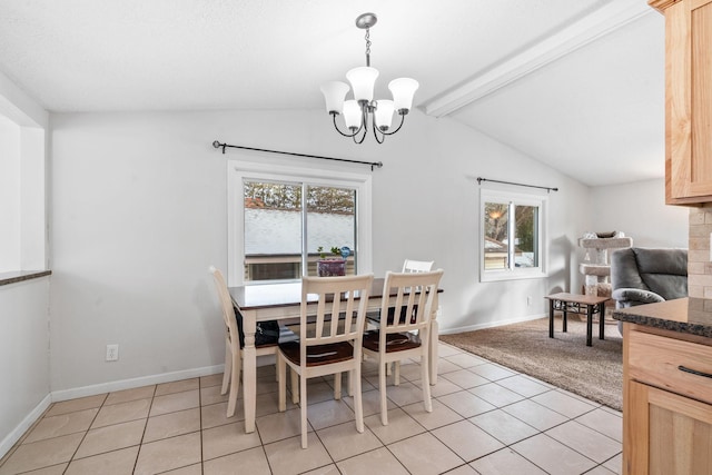 dining area featuring a chandelier, lofted ceiling with beams, and light tile patterned floors