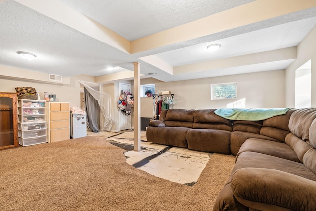 living room with light carpet and a textured ceiling