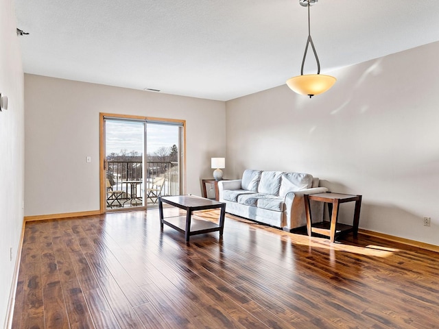 living room with dark hardwood / wood-style floors