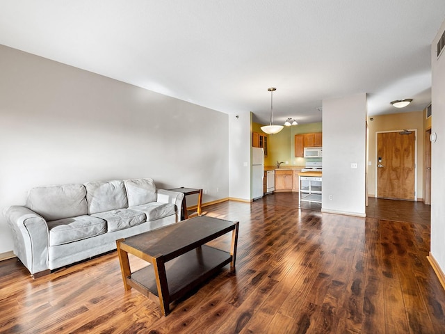 living room with dark wood-type flooring