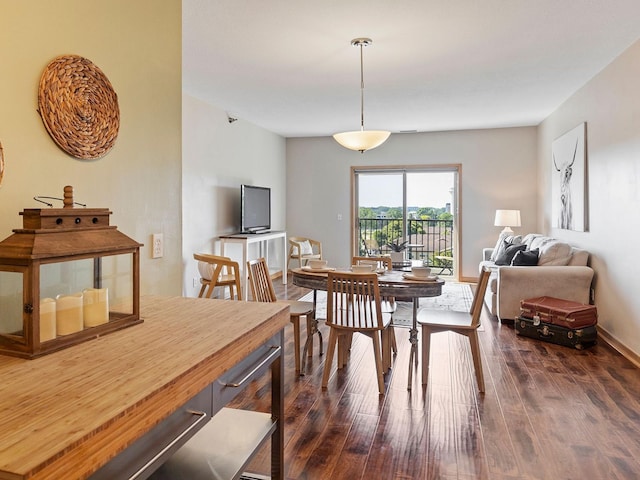 dining space with dark wood-type flooring