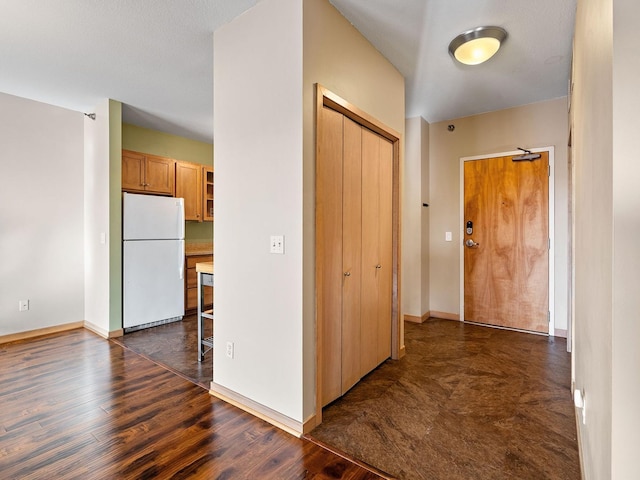 hall with dark wood-type flooring