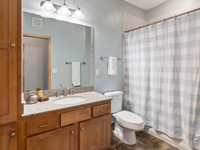 full bathroom featuring vanity, shower / bathtub combination with curtain, and toilet