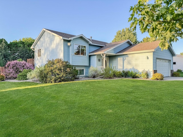 view of front of home with a garage and a front yard