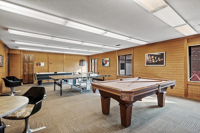 7500 Cahill Rd Unit 207C, Edina, MN 55439 - playroom with billiards table, a textured ceiling, light colored carpet, and wooden walls