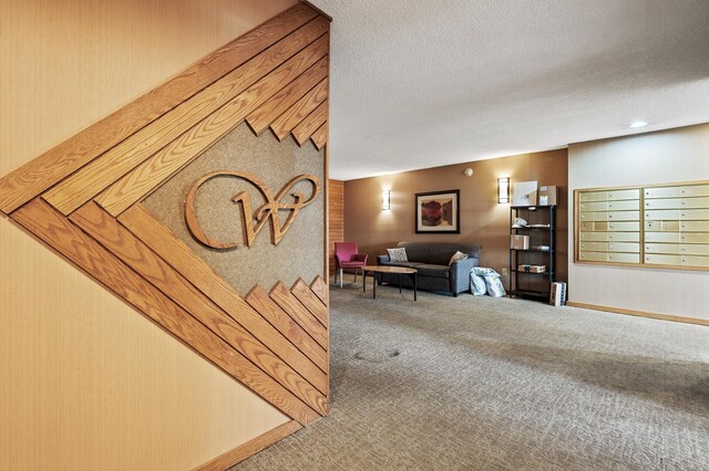 7500 Cahill Rd Unit 207C, Edina, MN 55439 - carpeted living area with mail area and a textured ceiling