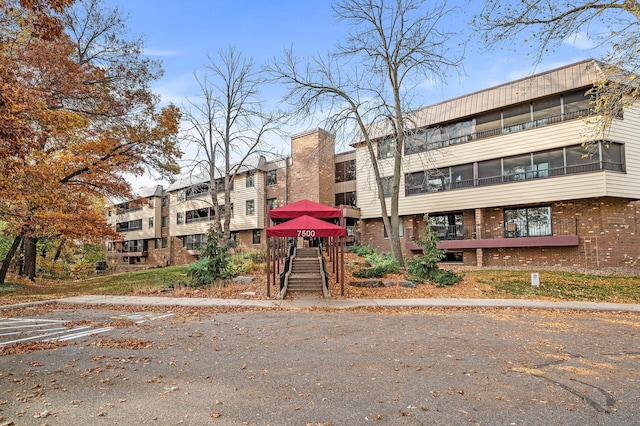 7500 Cahill Rd Unit 207C, Edina, MN 55439 - view of property featuring uncovered parking