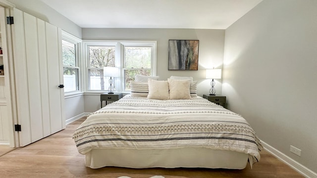 bedroom featuring light wood-type flooring