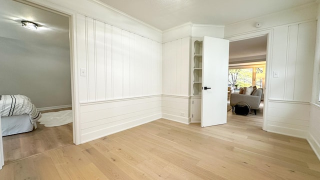 unfurnished bedroom featuring light wood-type flooring