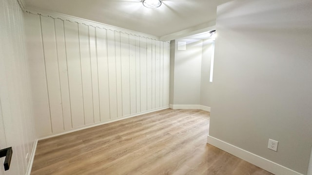 empty room with light hardwood / wood-style floors