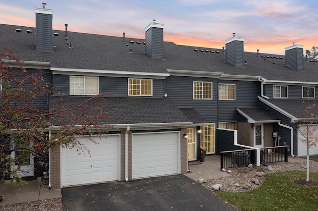 view of front of property with a garage