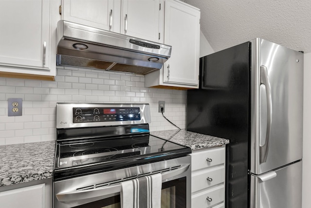 kitchen with backsplash, white cabinets, light stone countertops, and stainless steel appliances