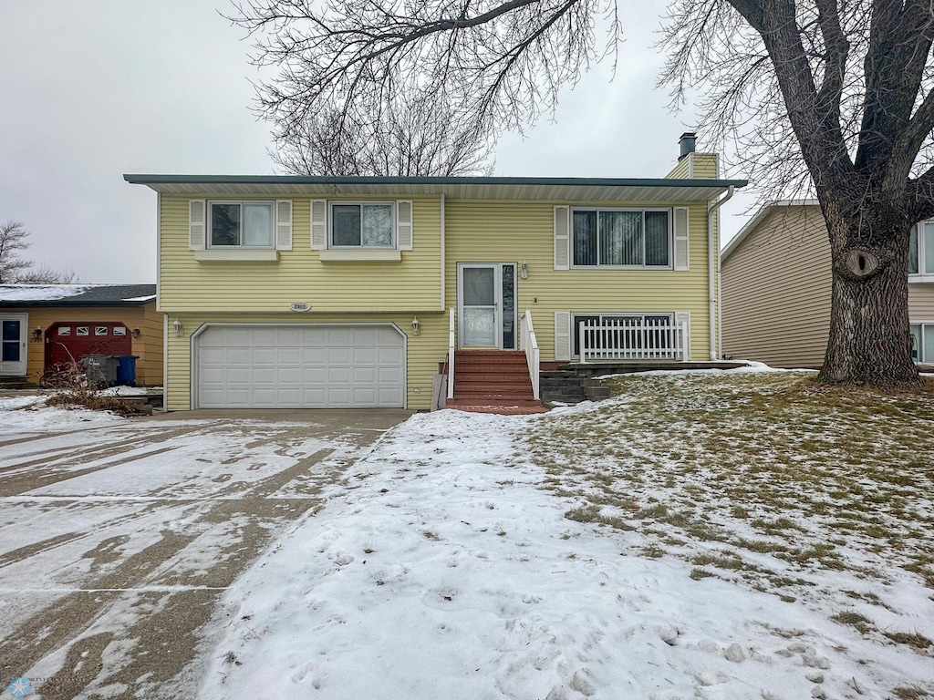 bi-level home featuring a garage