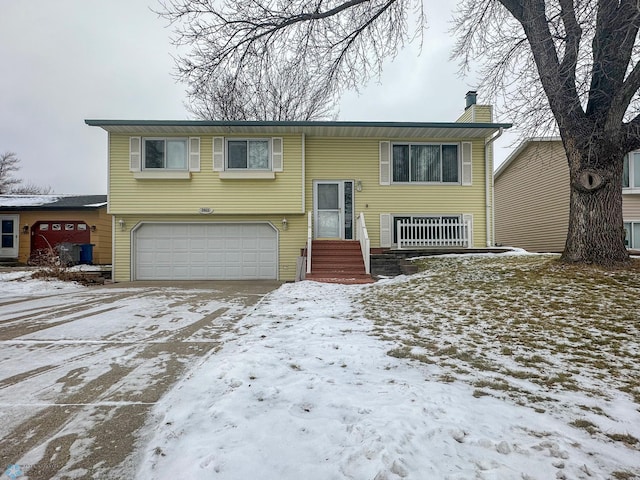 bi-level home featuring a garage