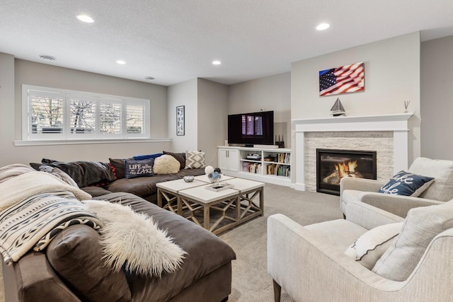 carpeted living room with a fireplace