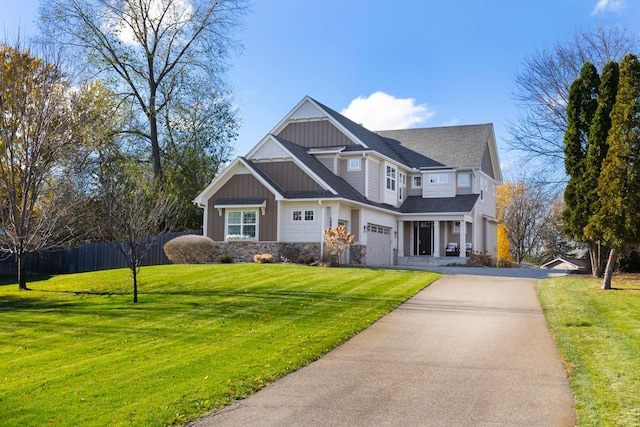 view of front of house with a front lawn and a garage