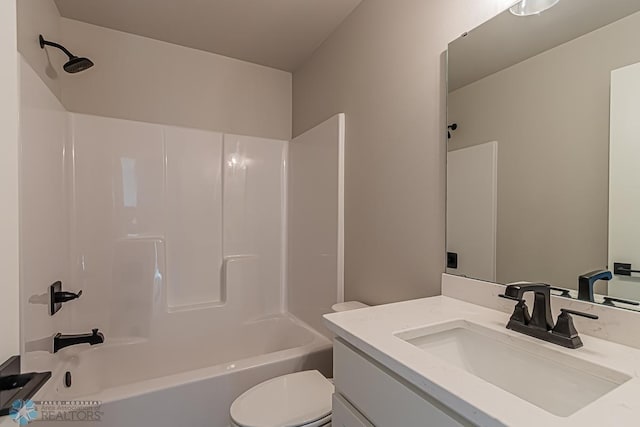 full bathroom featuring toilet, vanity, and shower / washtub combination