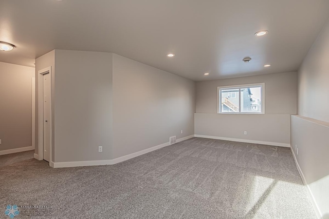 unfurnished room featuring carpet