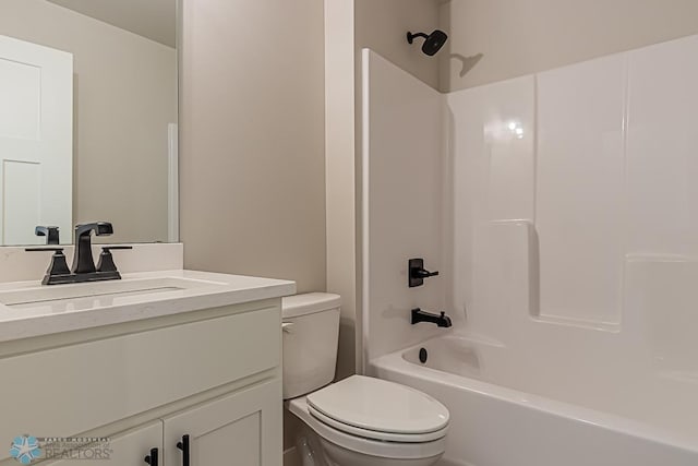 full bathroom with vanity, bathing tub / shower combination, and toilet