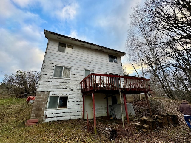 back of property featuring a deck