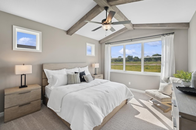 bedroom featuring ceiling fan, light carpet, and lofted ceiling with beams