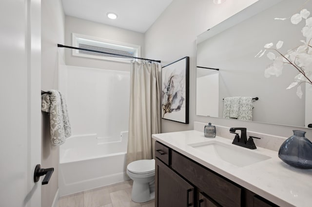 full bathroom with vanity, toilet, and shower / tub combo with curtain