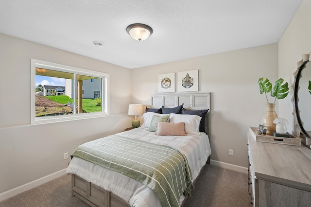 bedroom featuring dark carpet