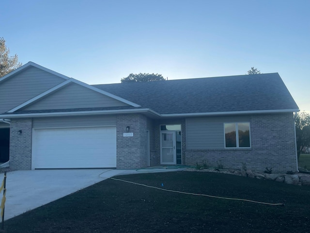 single story home featuring a garage