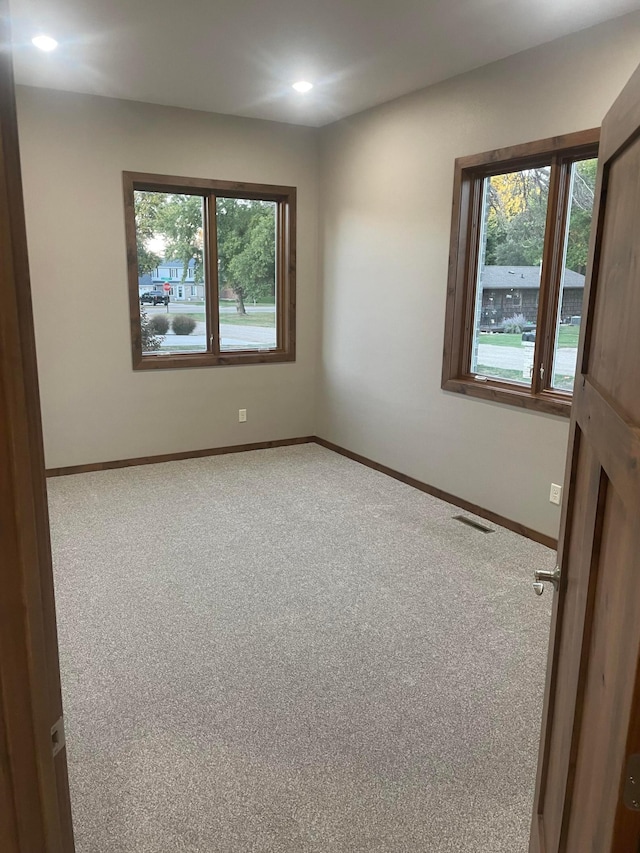 unfurnished room with carpet flooring